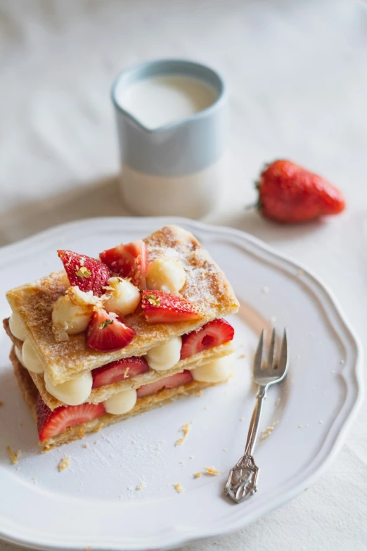 a piece of pie topped with bananas and strawberries on a plate
