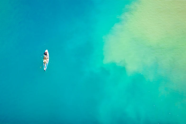 a aerial view of a person on a surfboard