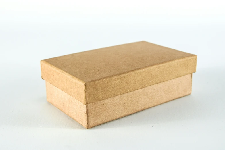 a large brown box on a white surface