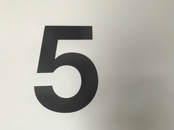 the number five printed onto the side of a white paper sheet
