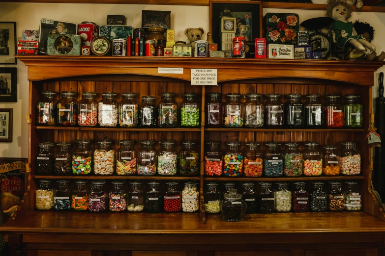 a wooden shelf filled with various types of food