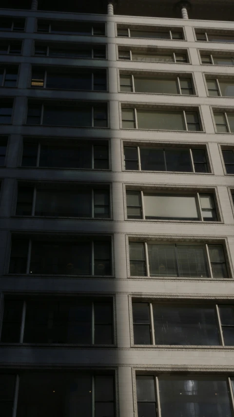 a clock that is on the side of a tall building