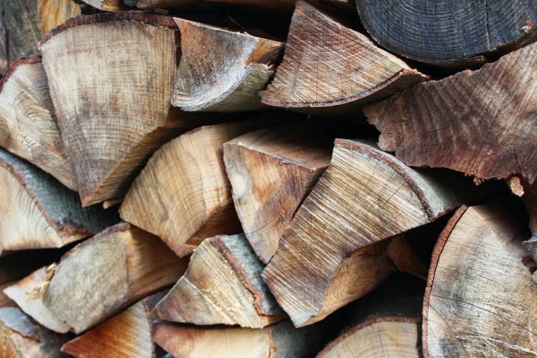 a large pile of logs stacked on top of each other