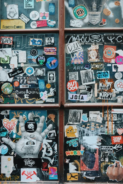 a bunch of stickers and other items that are on a building