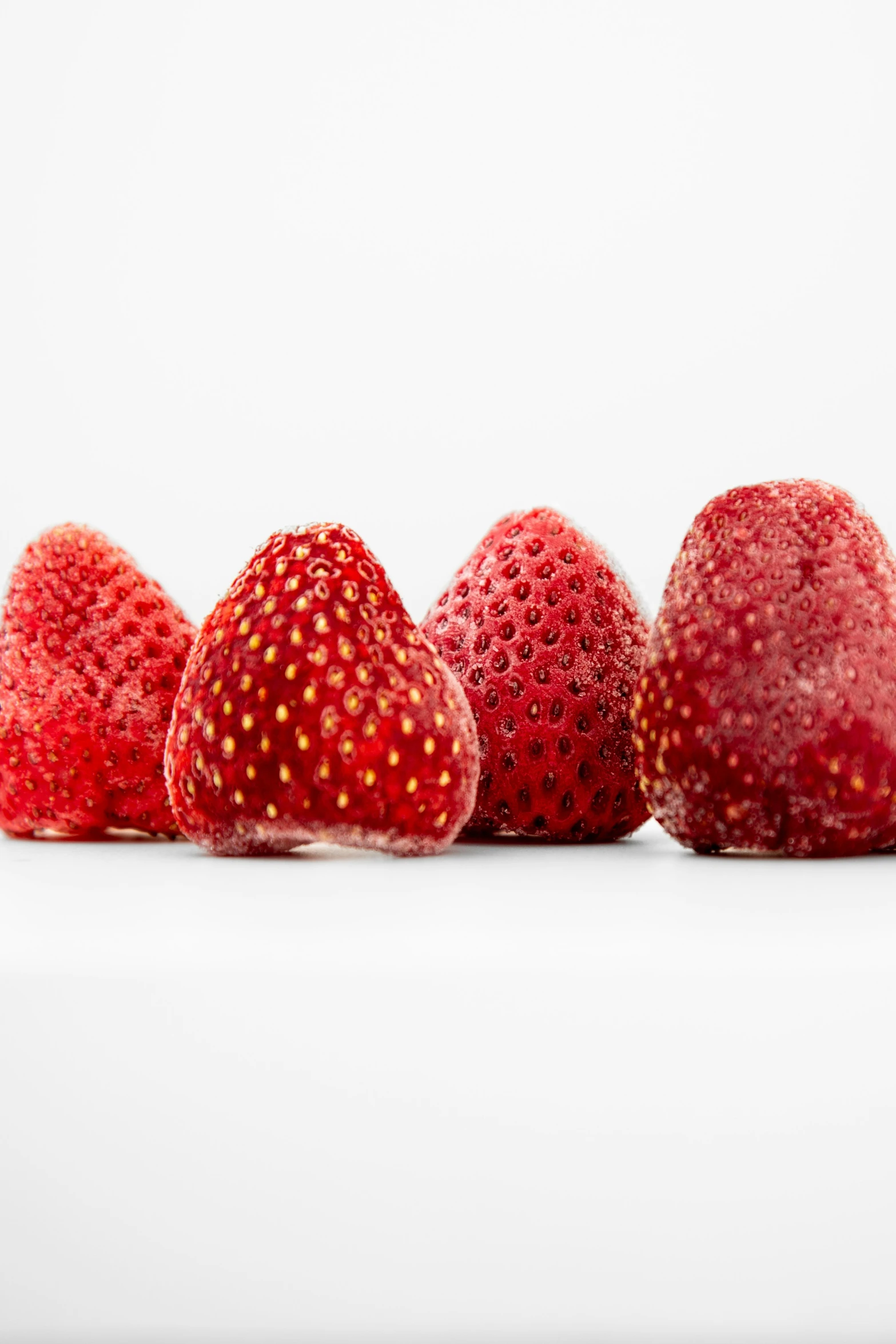 three pieces of strawberries have been placed in the same line