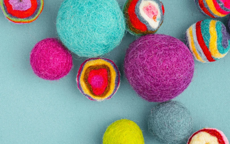 a variety of balls, and wool covered in colorful yarn