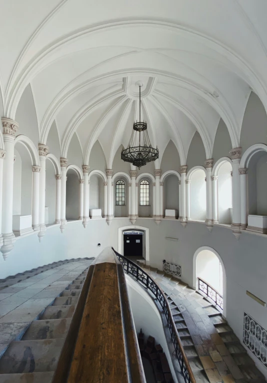 the chandelier and marble floor in an old church