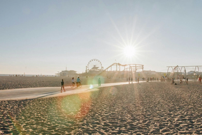 a group of people are on the beach