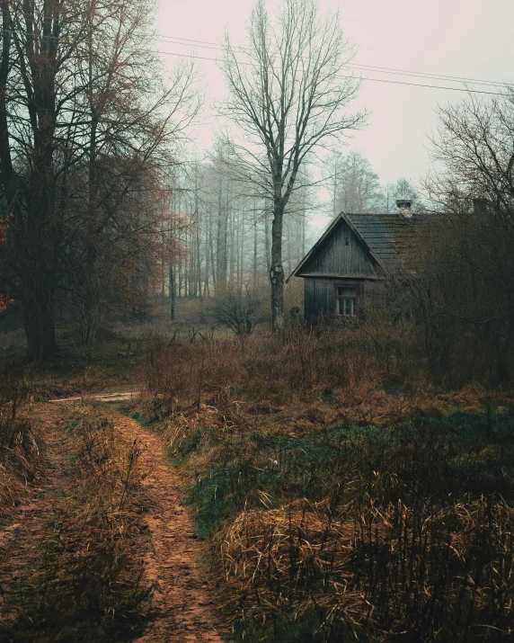 a very old house sitting next to trees