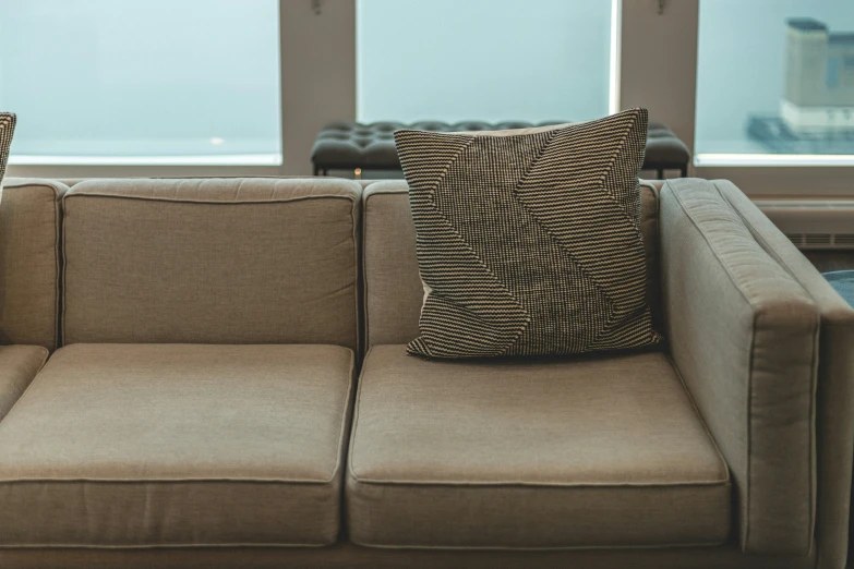an image of a couch in front of a window