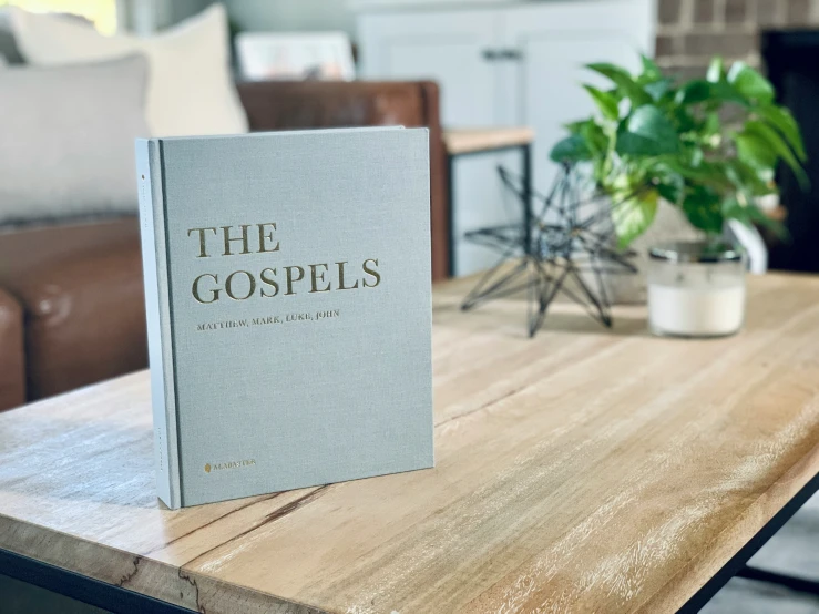 the book is resting on a coffee table in front of a couch