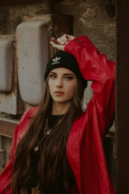 young lady dressed up in red covering herself