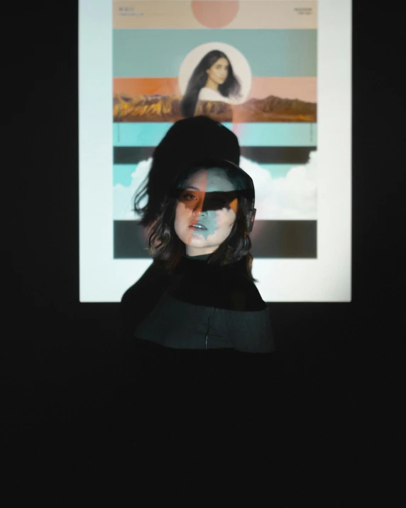 a woman with sunglasses on looking at a screen with the image of a girl on it