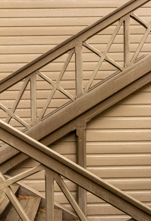 an empty stairway on the outside of an old building