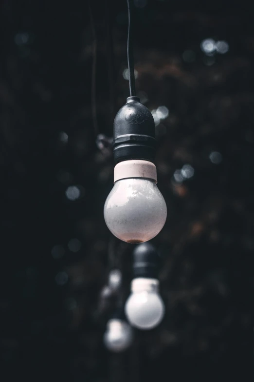 a light bulb hanging down from a ceiling