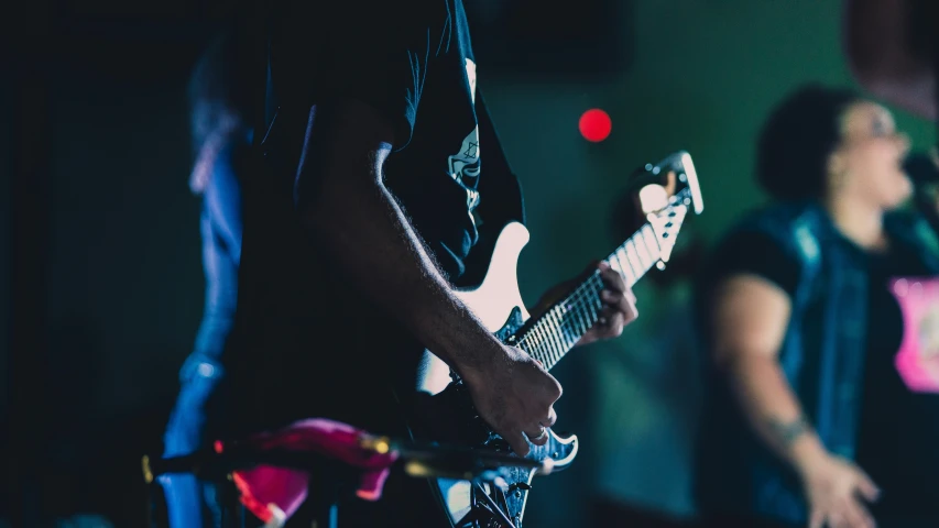 two musicians playing musical instruments with a blurred background