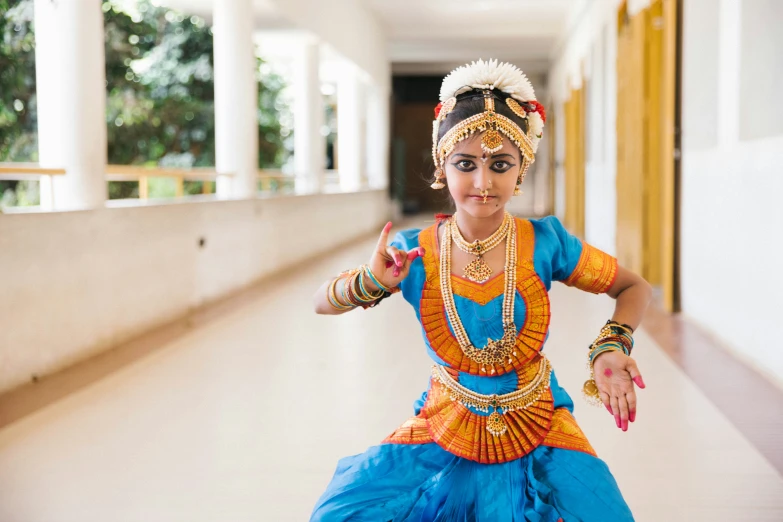 a person standing in a hallway doing some kind of dance