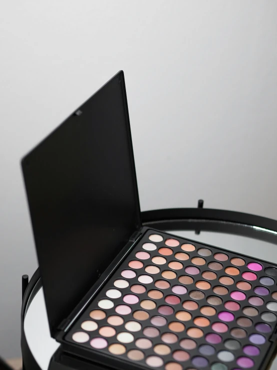 a makeup palette sits in an open case