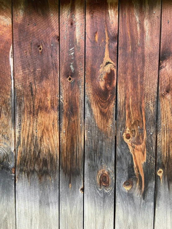 a wooden plank with wood carving and peeling paint