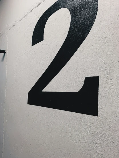 a close up of a number on a sign with the letter 2