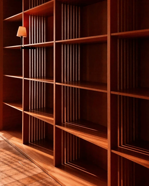 a large brown bookcase with several shelves on top of it