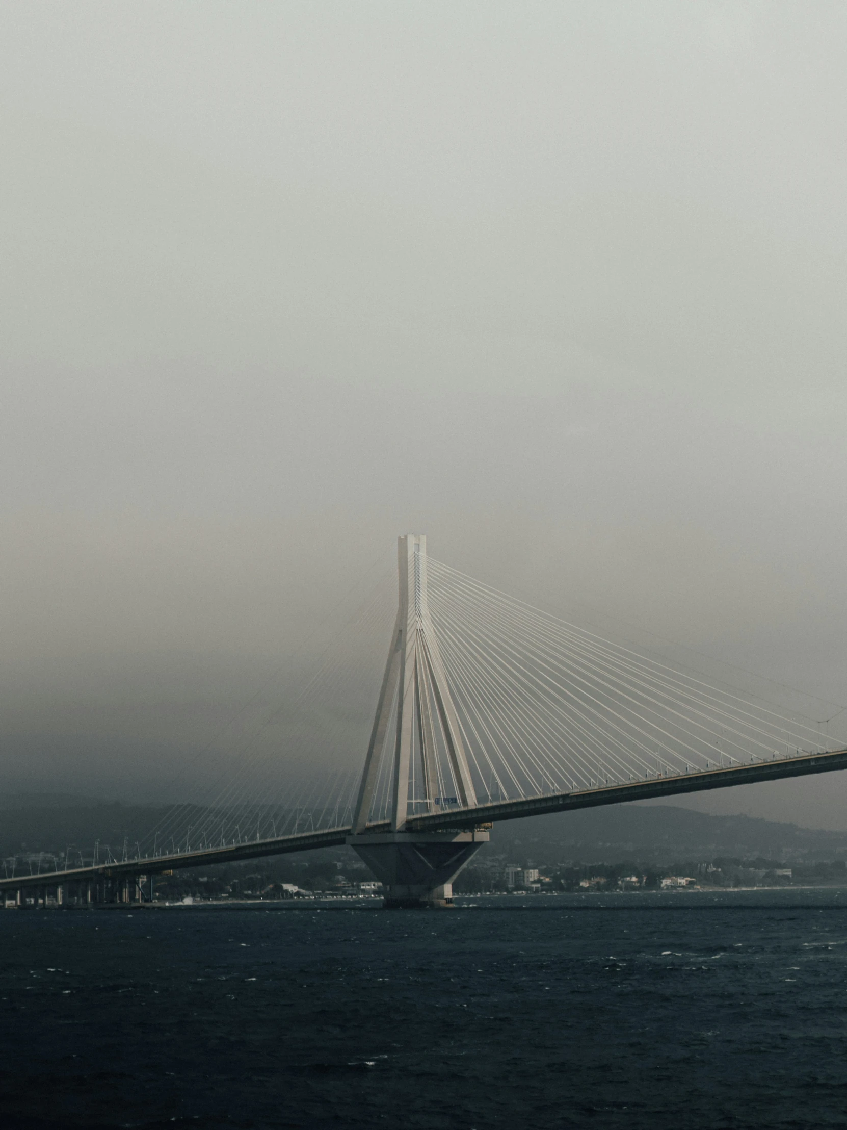 a bridge crosses across the large body of water