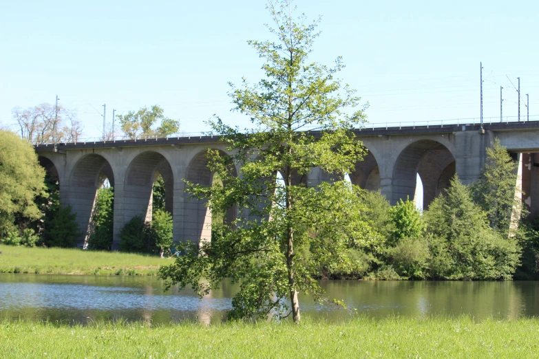 a tall bridge is over a body of water