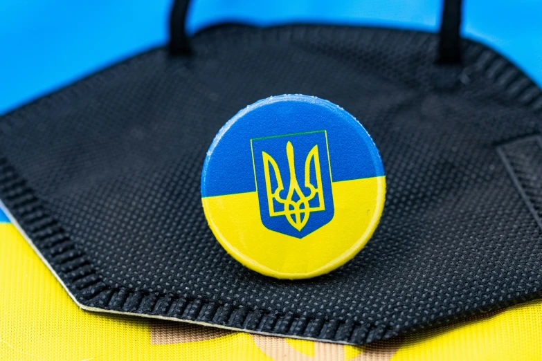 a closeup of a pin with a flag of ukraine