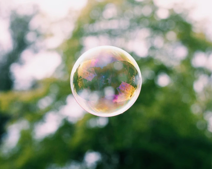 a bubble shaped like a house in the air