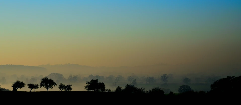 a lone plane is flying in the distance