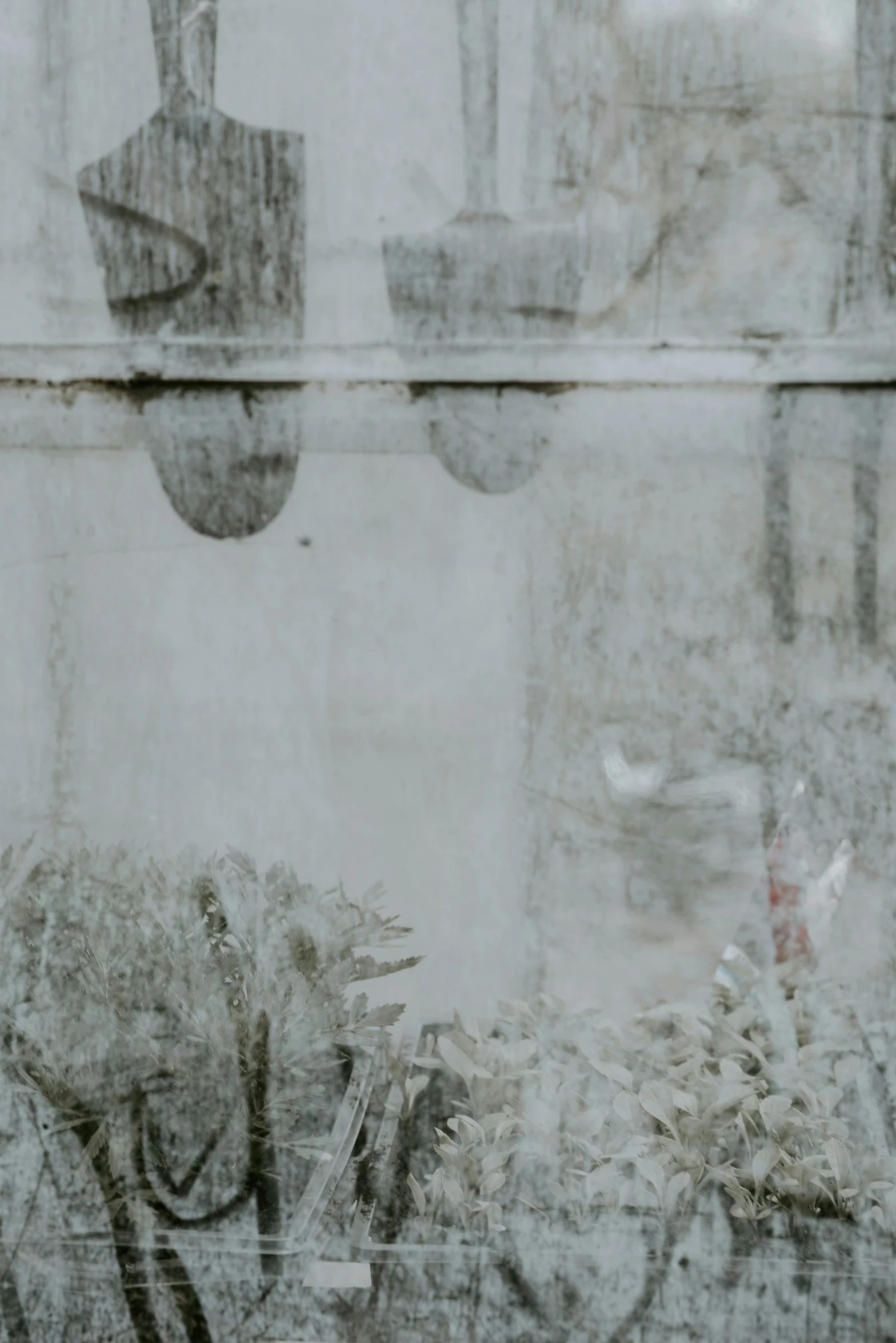 a old picture of a window with an umbrella and a vase of flowers