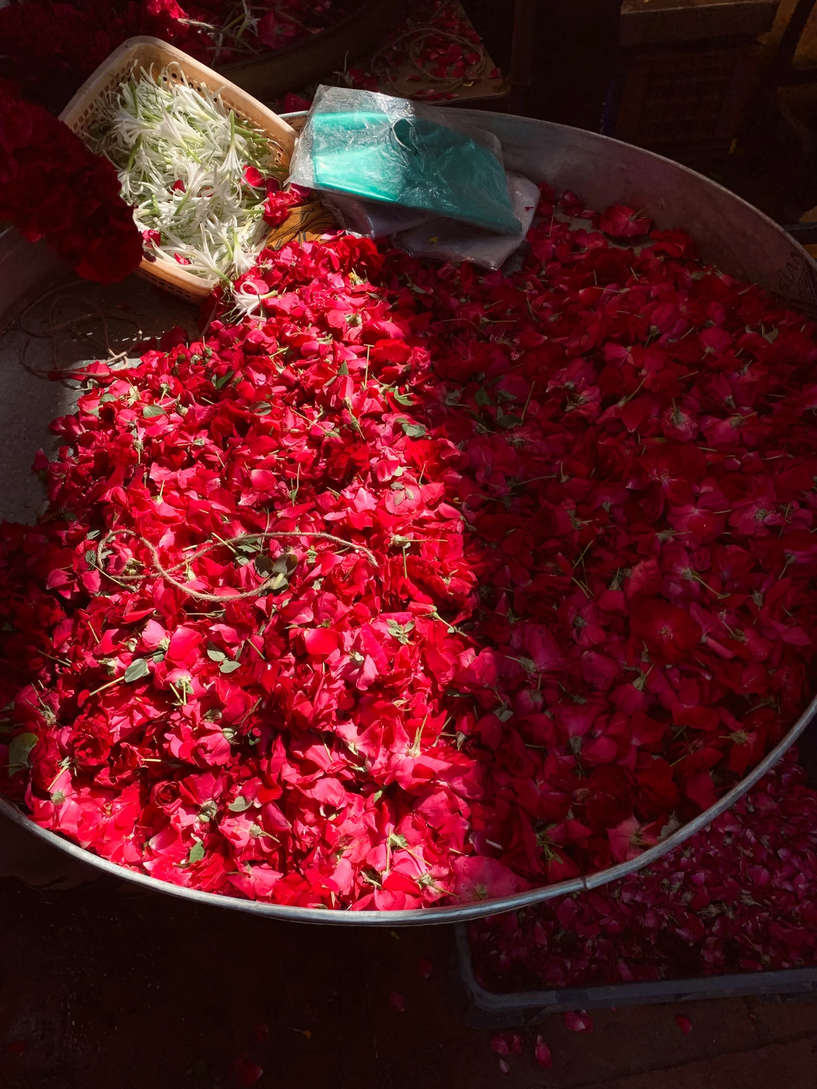 a bowl filled with red flowers on a table