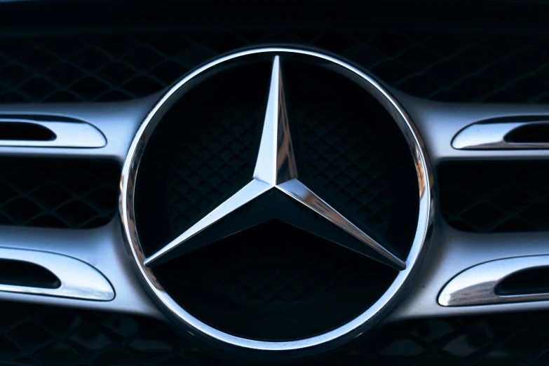 the mercedes badge is shown with black background