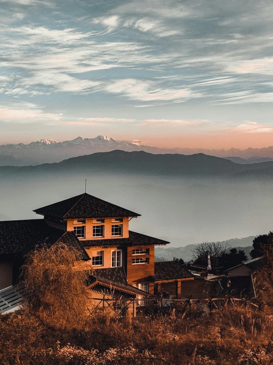 a house that is sitting on the top of a mountain