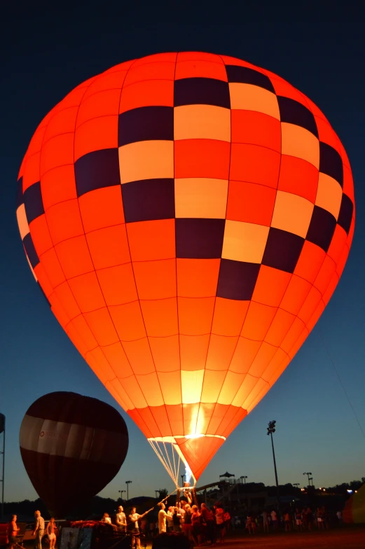 two  air balloons are shown in the night sky