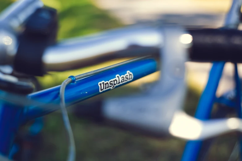 the back end of a bike with its light blue frame and the words bike on it