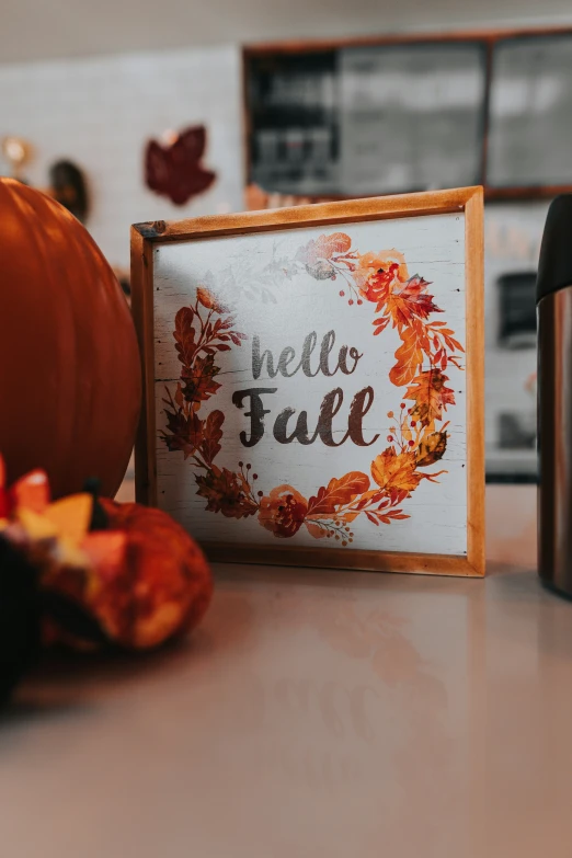 the words hello fall are displayed on an autumn decoration