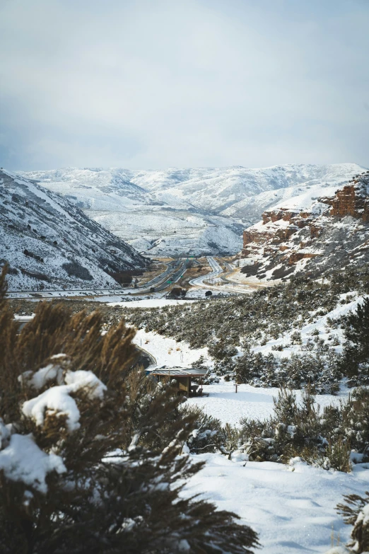 a snow covered valley in the mountains