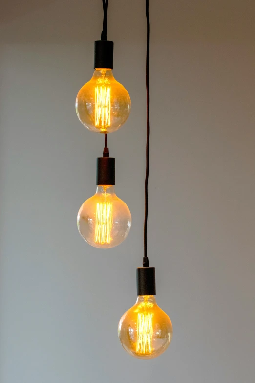 an image of light bulbs being hung up