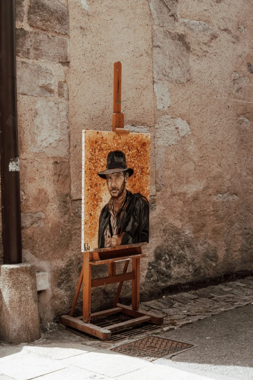 a man is shown sitting in front of a painting
