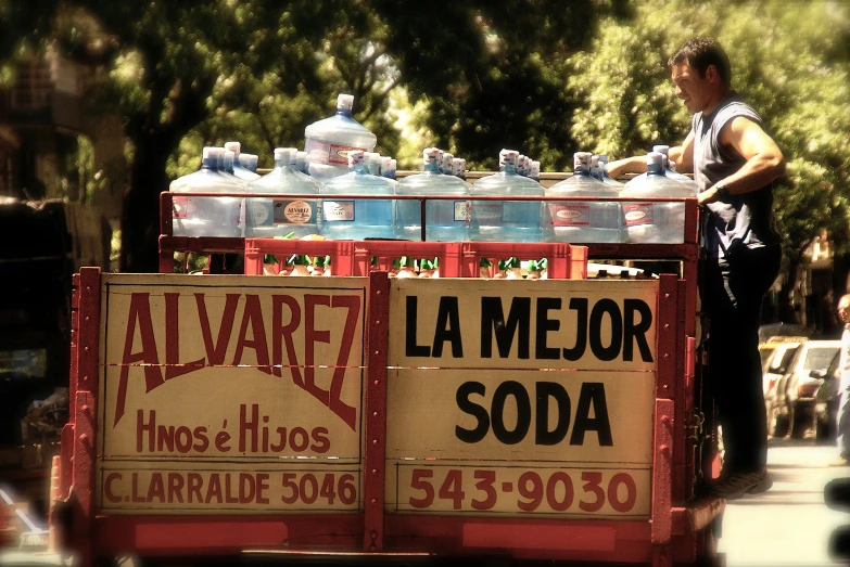 a cart selling water and plastic bottles on the street