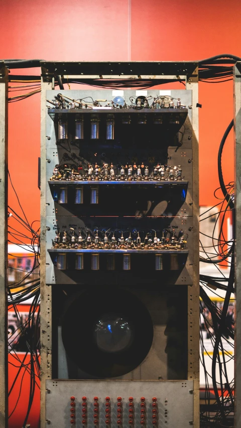the back of a computer with many wires in it