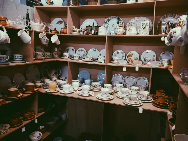 a room filled with lots of china and plates on shelves