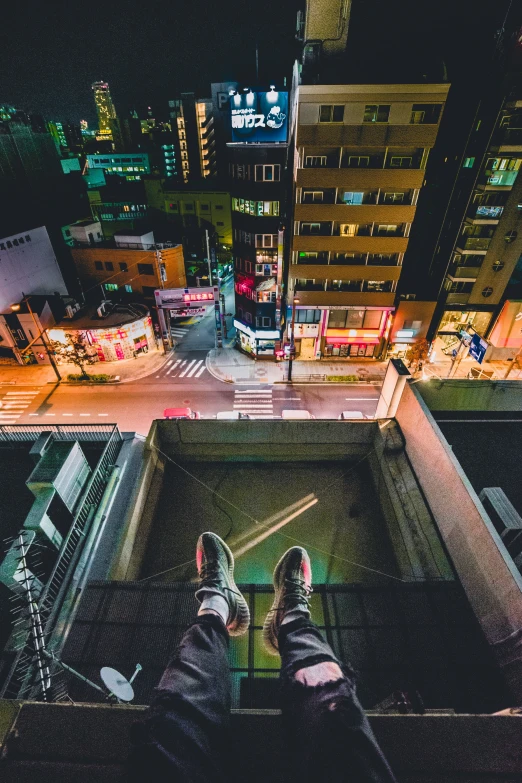 a person standing on a platform at night