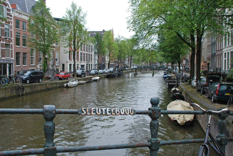 a street is flooded with cars, bicycles and pedestrians