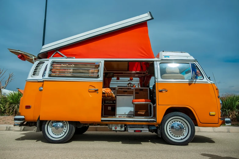 the vw bus is set up in front of a building