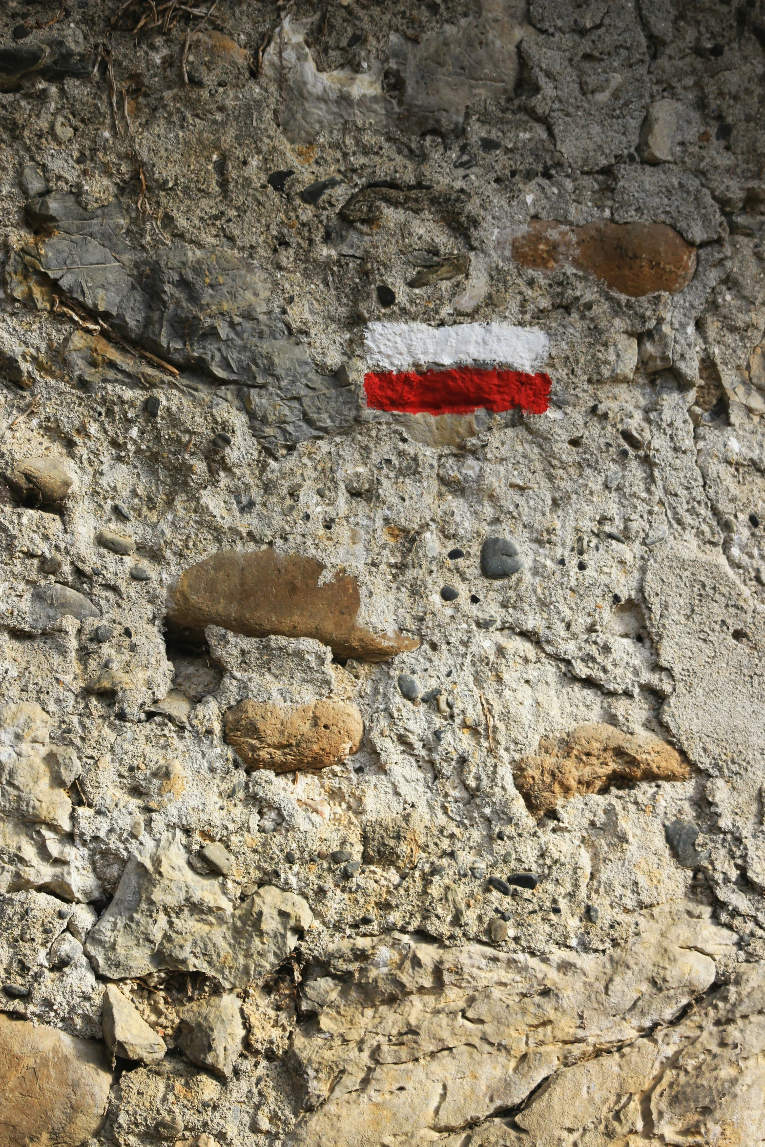 a flag sitting on top of a rock cliff