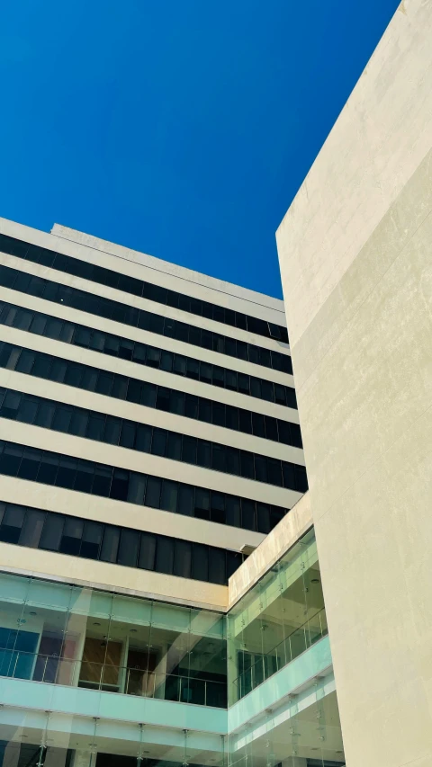 a very tall building with a glass on top of it