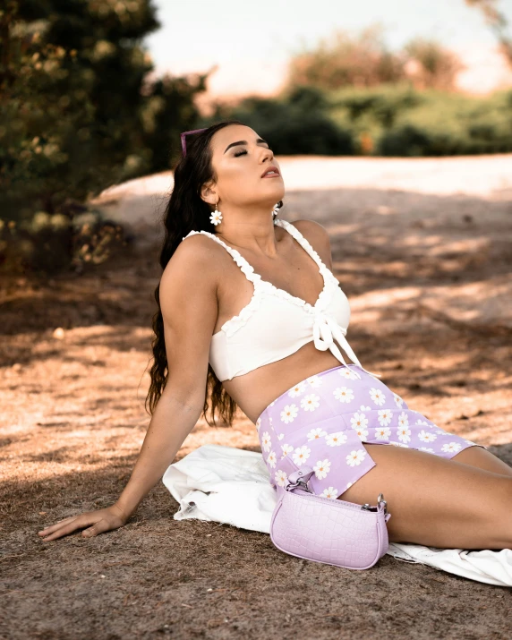 a young woman wearing pink and white shorts