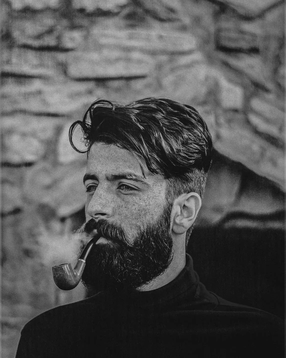 man with beard and mustache smoking pipe by wall